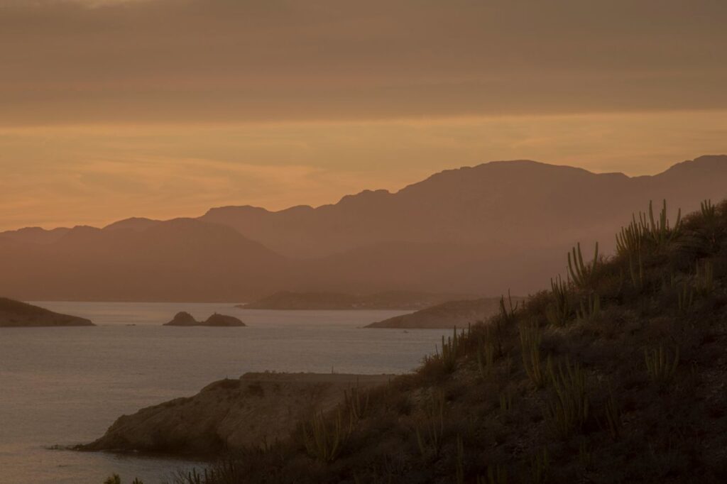 Breathtaking sunset view of San Carlos, Mexico with serene sea and hills.